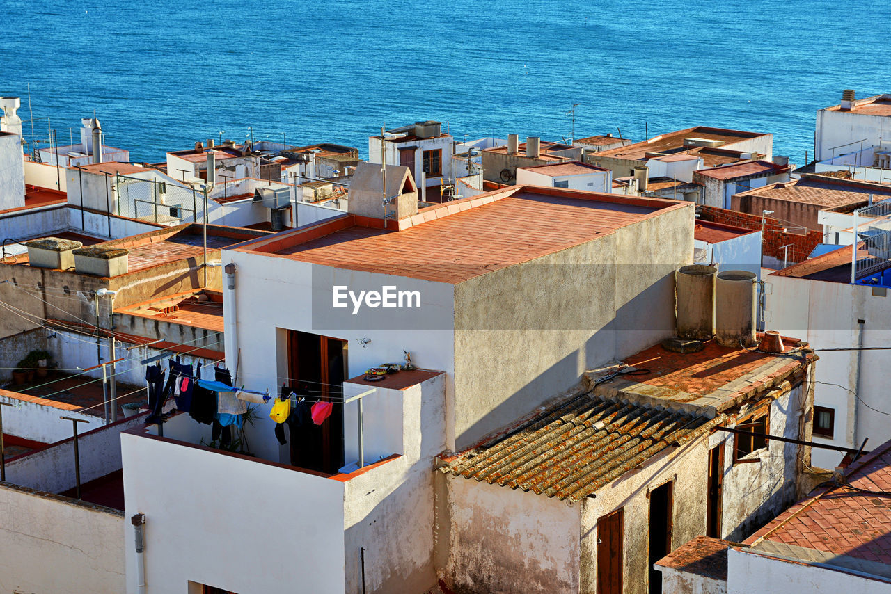 High angle view of houses by sea