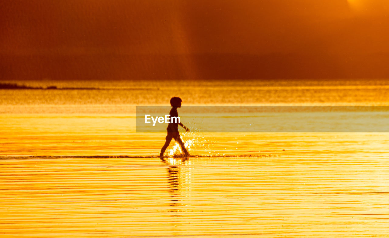 Kid silhouette at sunset