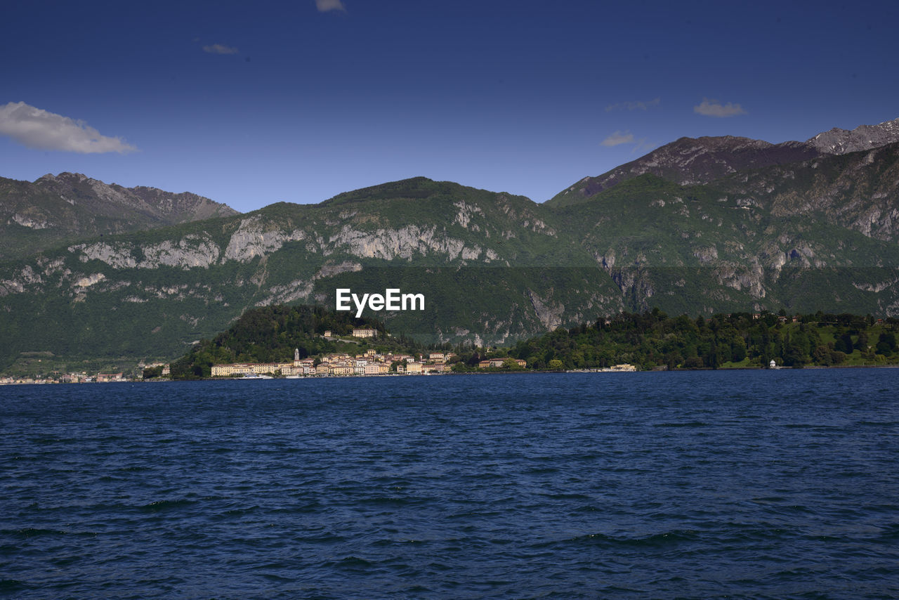 SCENIC VIEW OF SEA AND MOUNTAIN AGAINST SKY