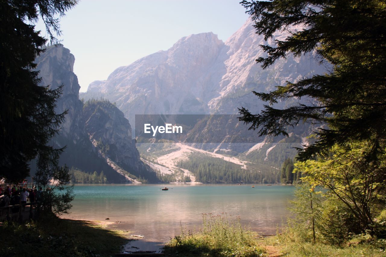 Scenic view of lake and mountains against sky