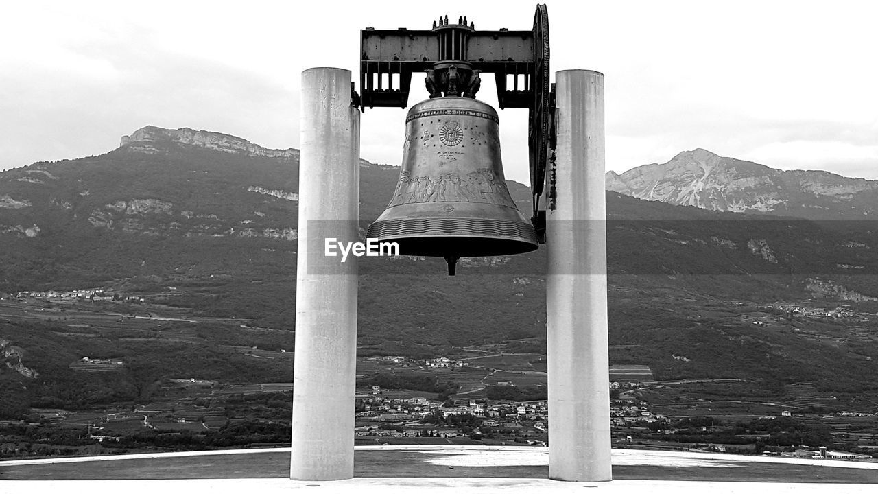 Bell tower against mountain