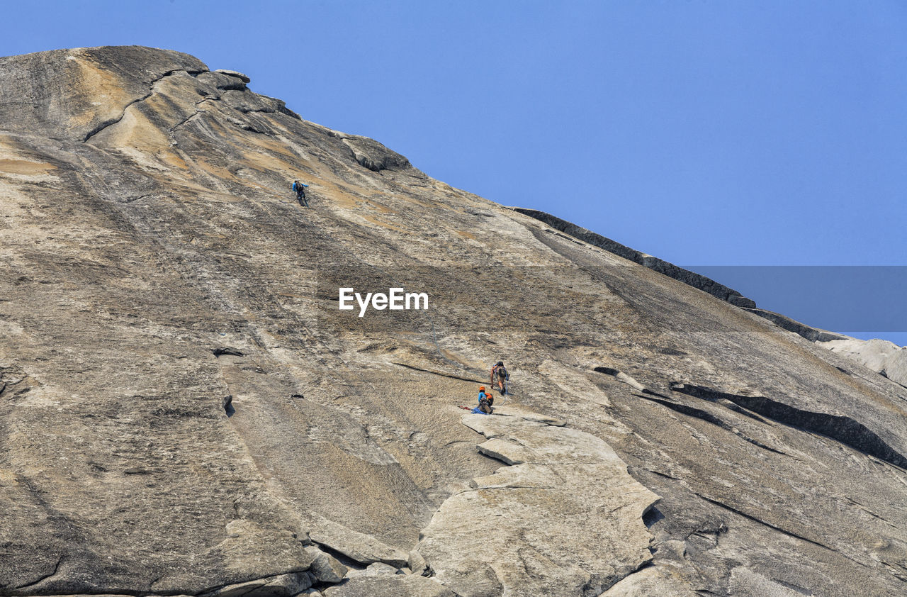 Low angle view of rock climbers at yosemite national park