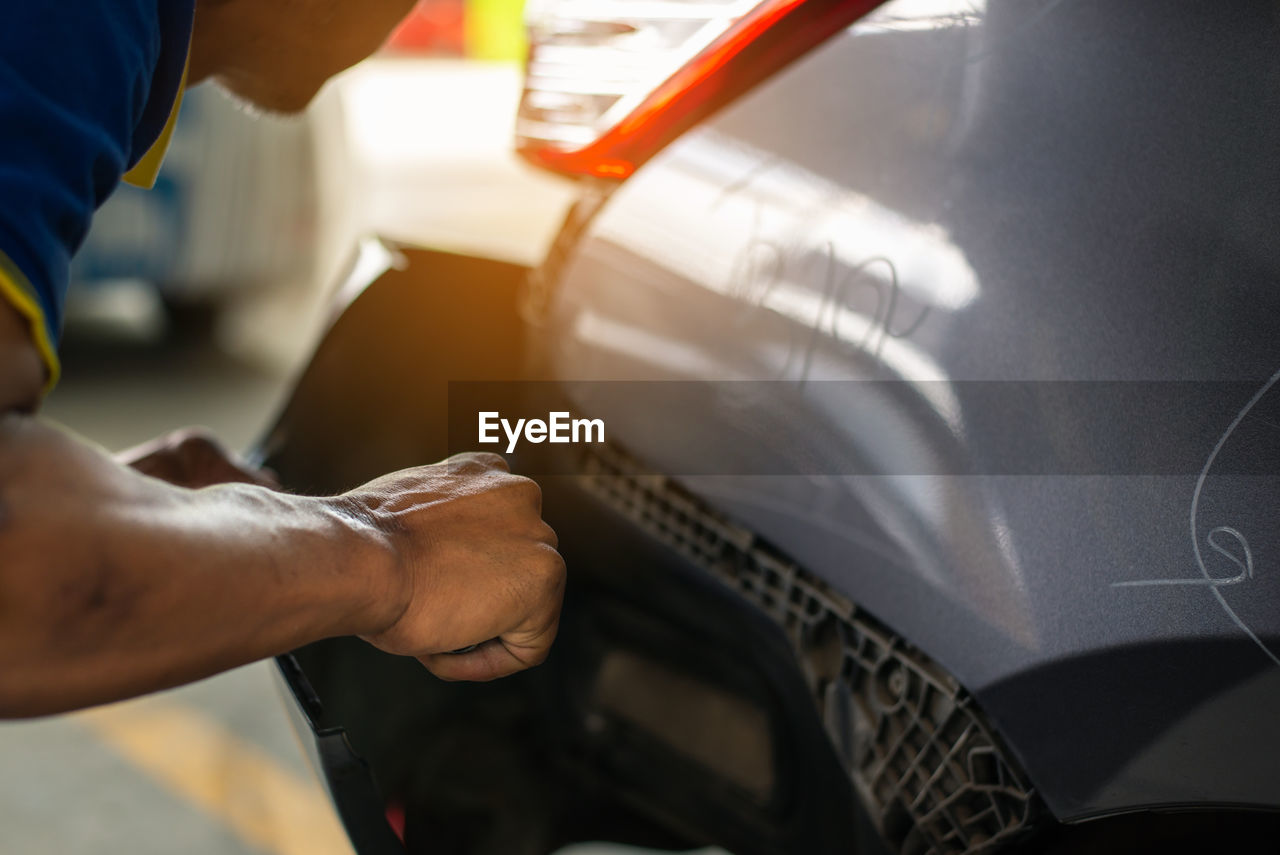 Mechanic repairing car in auto repair shop