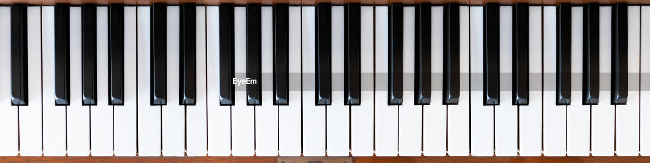 musical equipment, musical instrument, music, no people, piano, close-up, white, pattern, indoors, electronic device, piano key, arts culture and entertainment, side by side, in a row