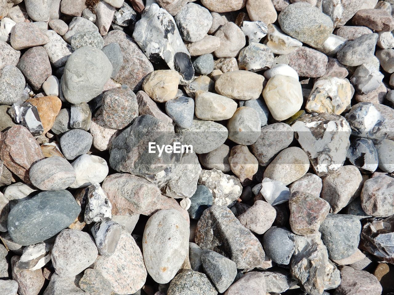 Full frame shot of pebbles on beach