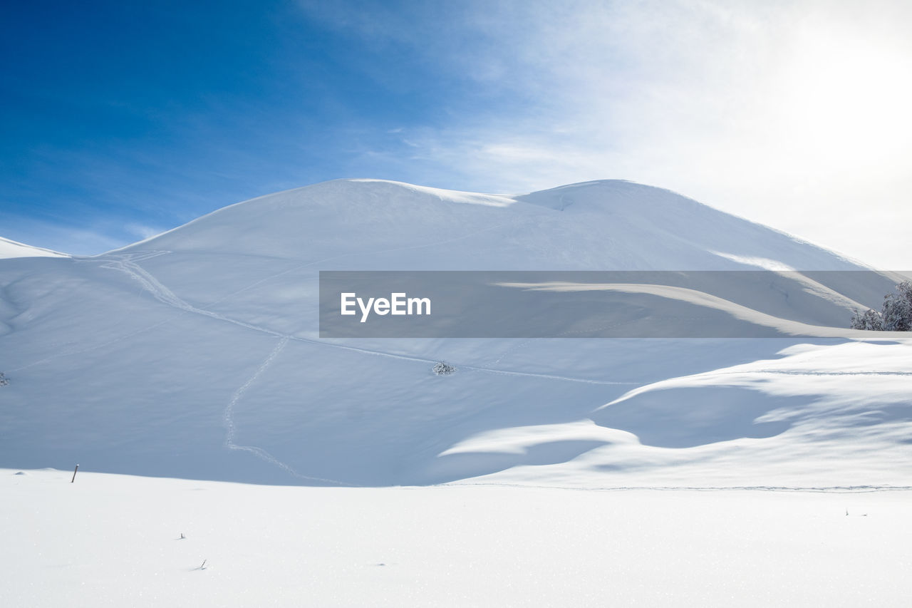 Scenic view of snowcapped mountains against sky in micigliano, lazio italy 