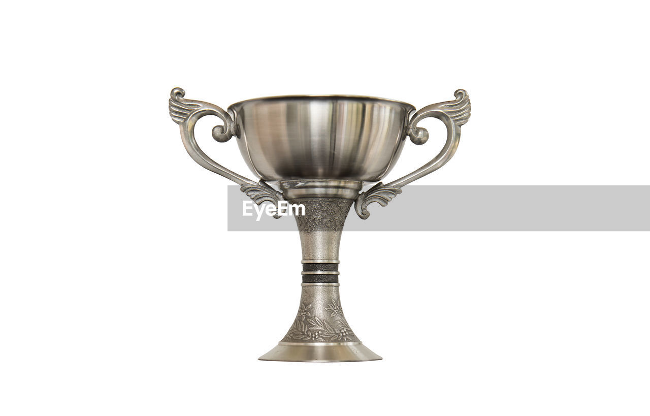 Close-up of trophy against white background