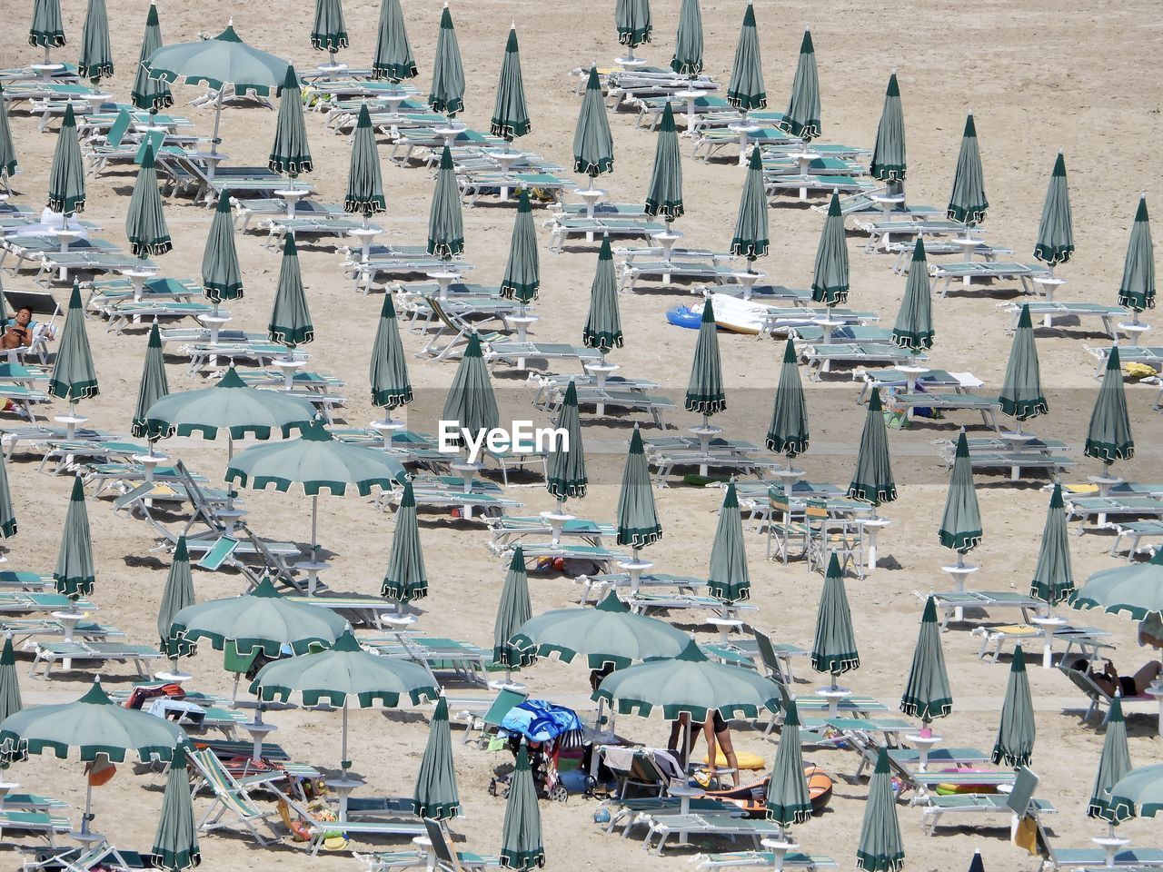 High angle view of closed umbrella in a beach