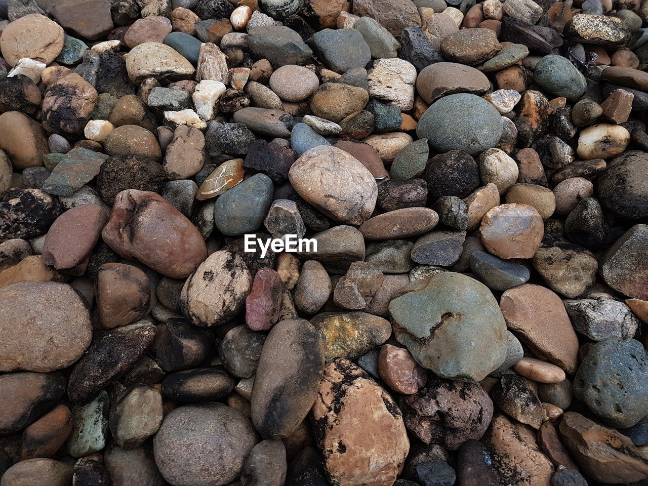 rock, backgrounds, full frame, large group of objects, stone, abundance, gravel, pebble, soil, nature, no people, land, day, textured, beach, high angle view, outdoors, rubble, pattern, shape, tranquility