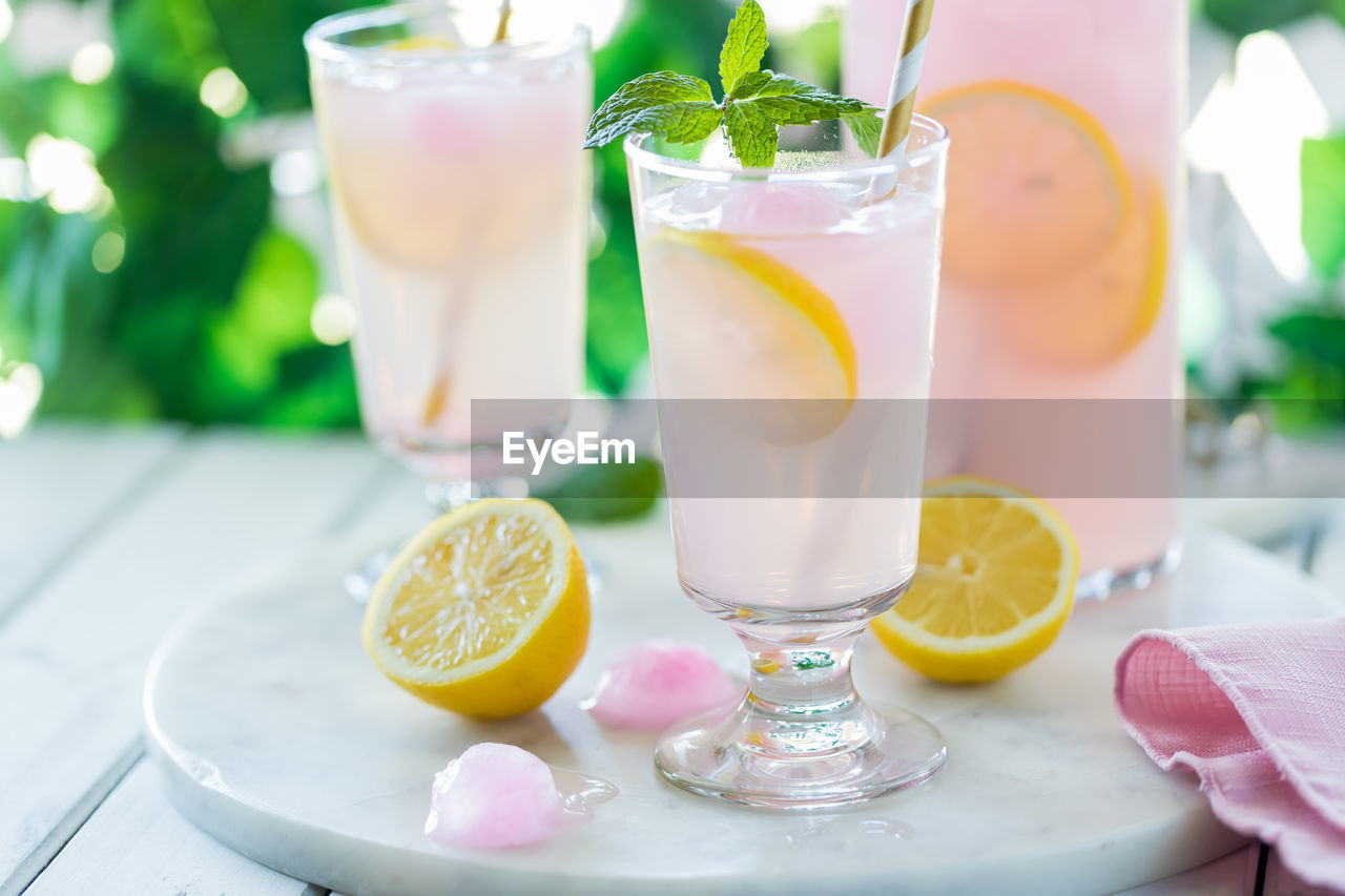 Frosty refreshing glasses of sweet lemonade, ready for drinking.
