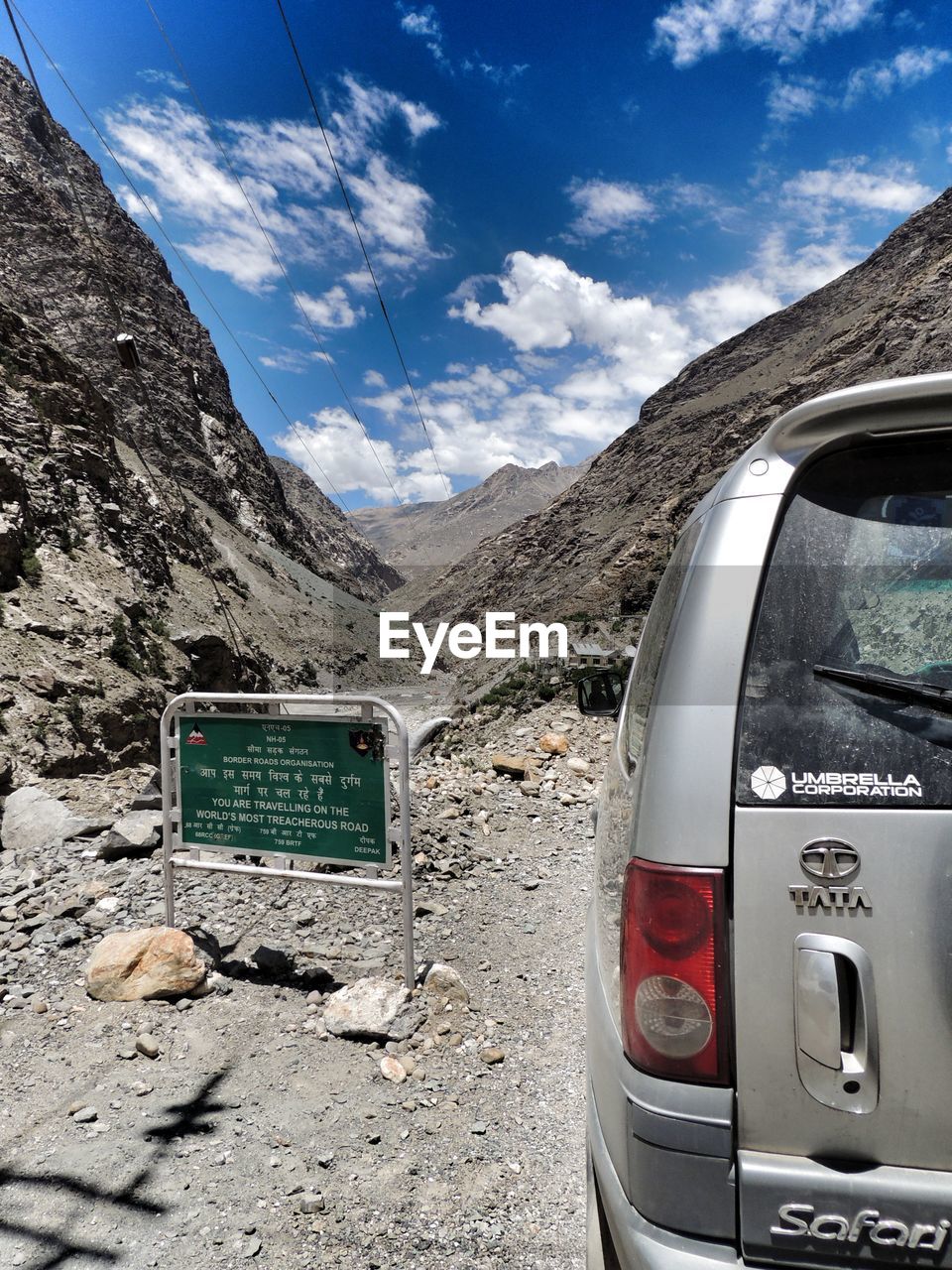 TELEPHONE BOOTH AGAINST MOUNTAIN RANGE