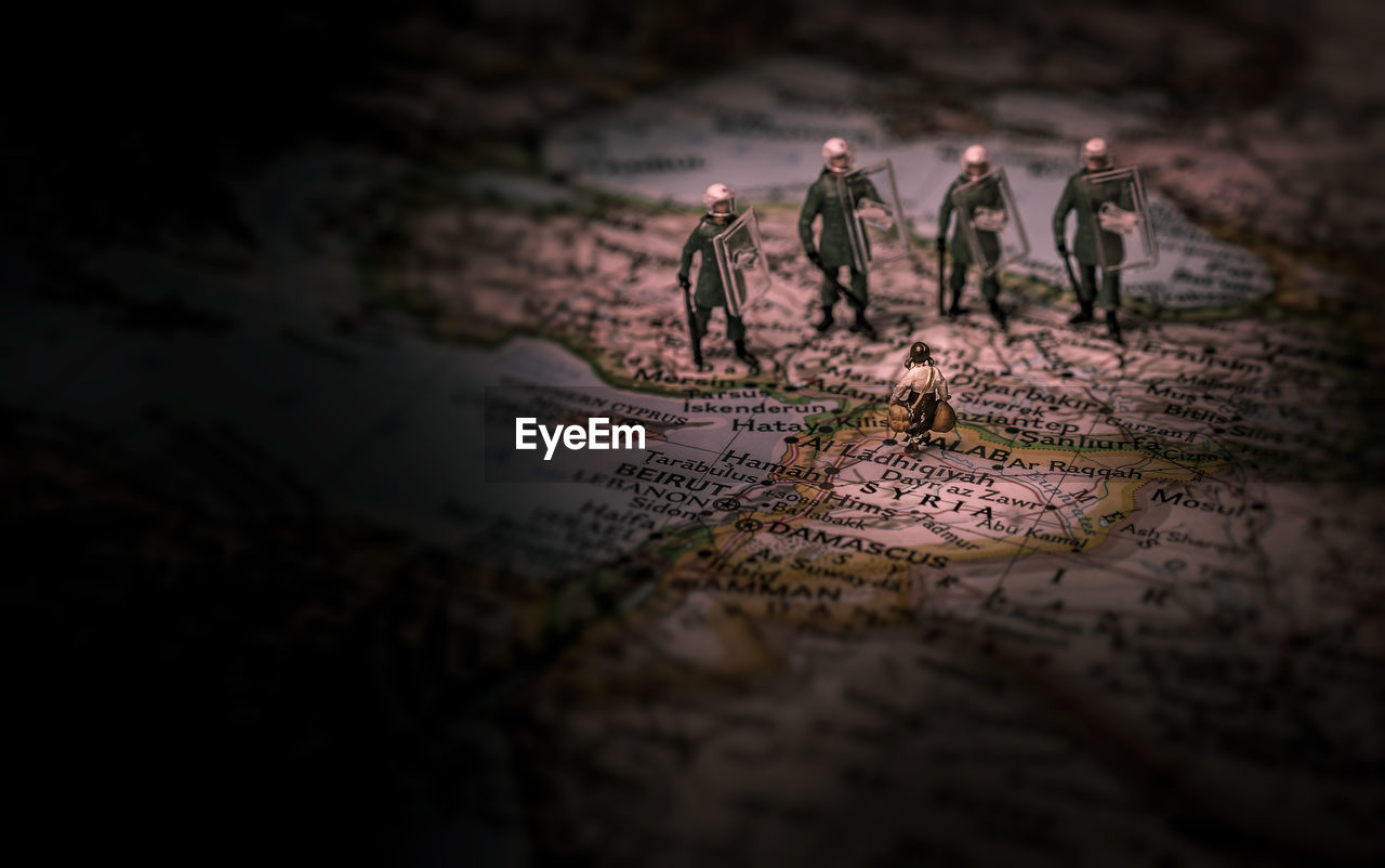 Close-up of figurines on map