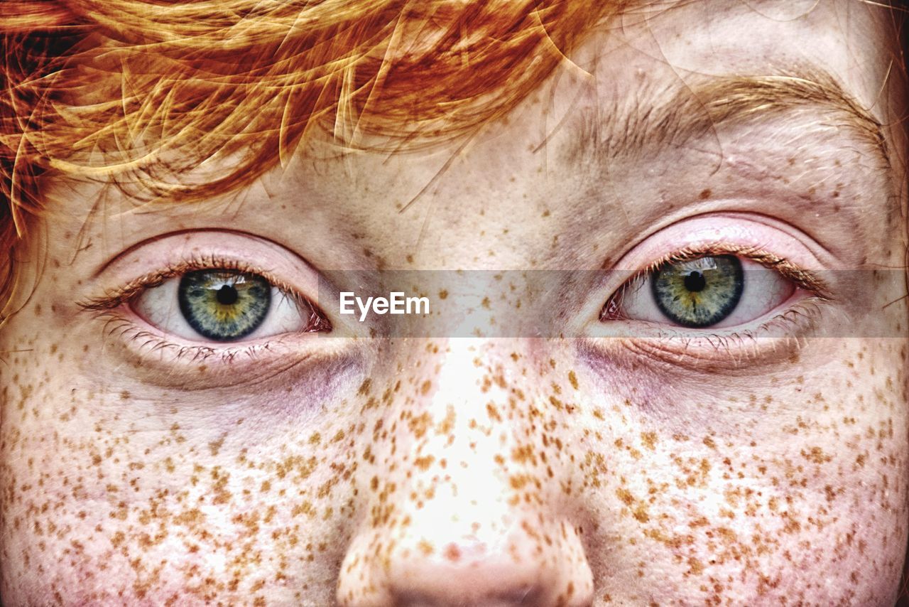 Close-up portrait of boy with freckles