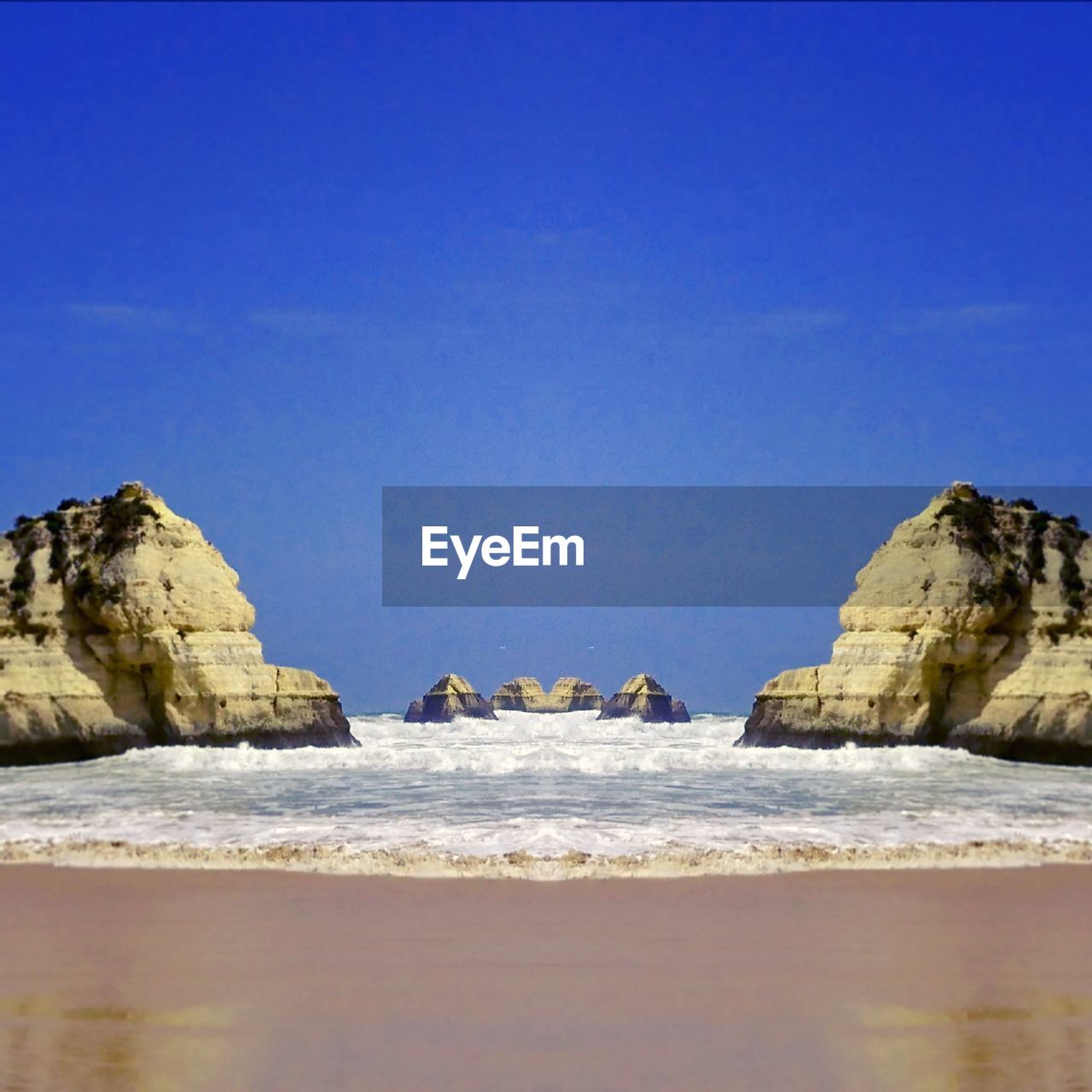 SCENIC VIEW OF BEACH AGAINST CLEAR BLUE SKY