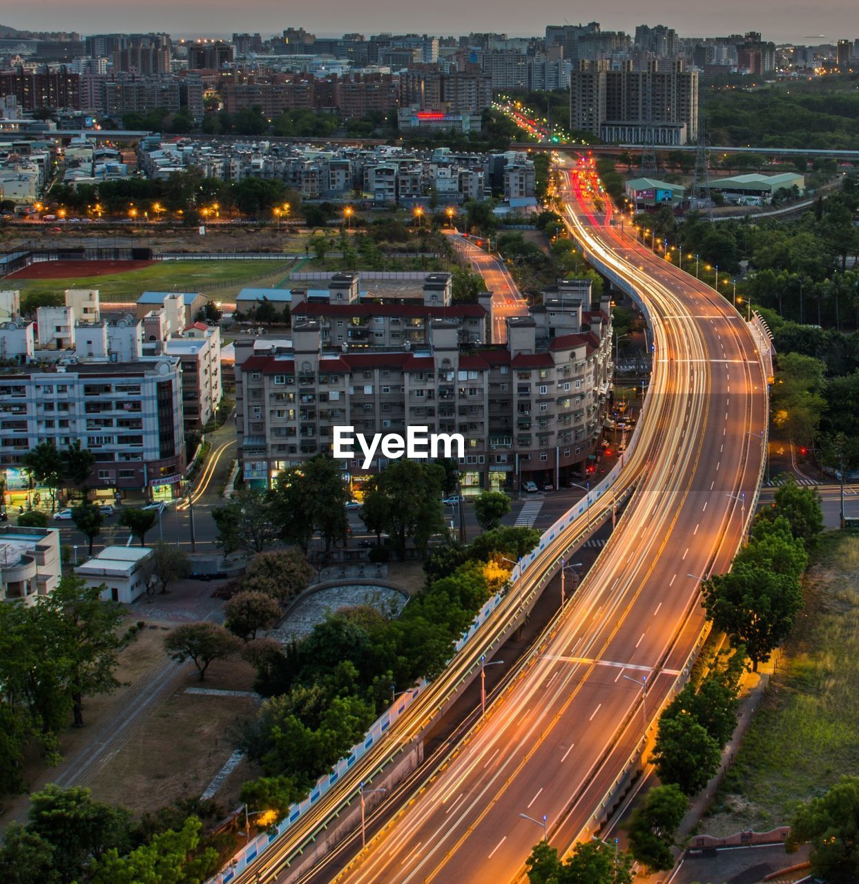 High angle view of light trails on road in city