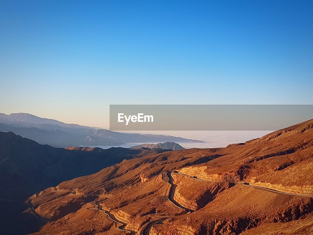 Scenic view of mountain range against clear sky