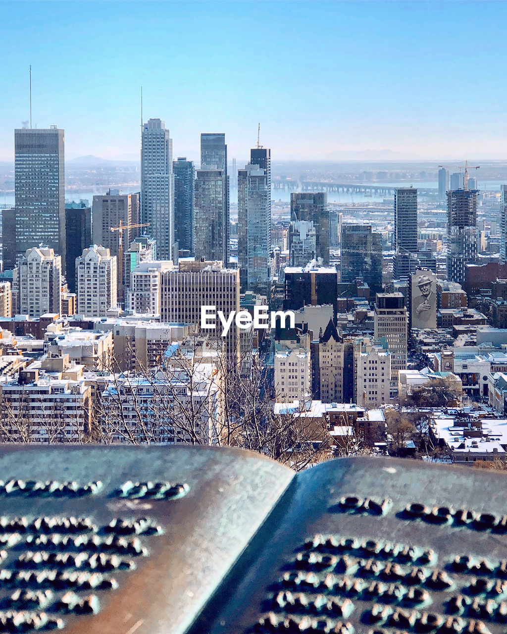 Aerial view of modern buildings in city against sky