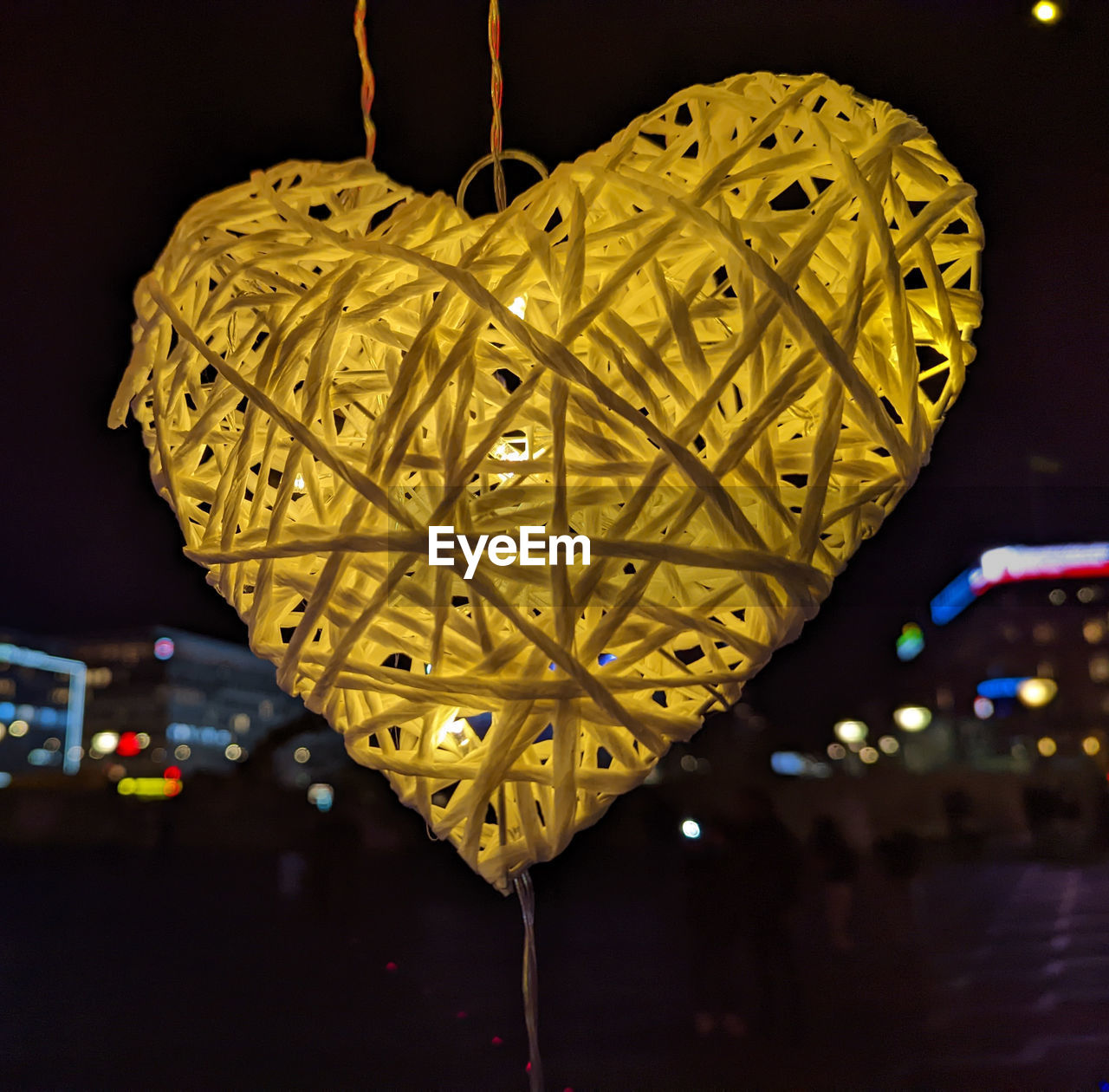 yellow, night, illuminated, heart shape, decoration, light, hanging, lighting, lighting equipment, no people, positive emotion, city, architecture, emotion, love, flower, celebration, leaf, outdoors