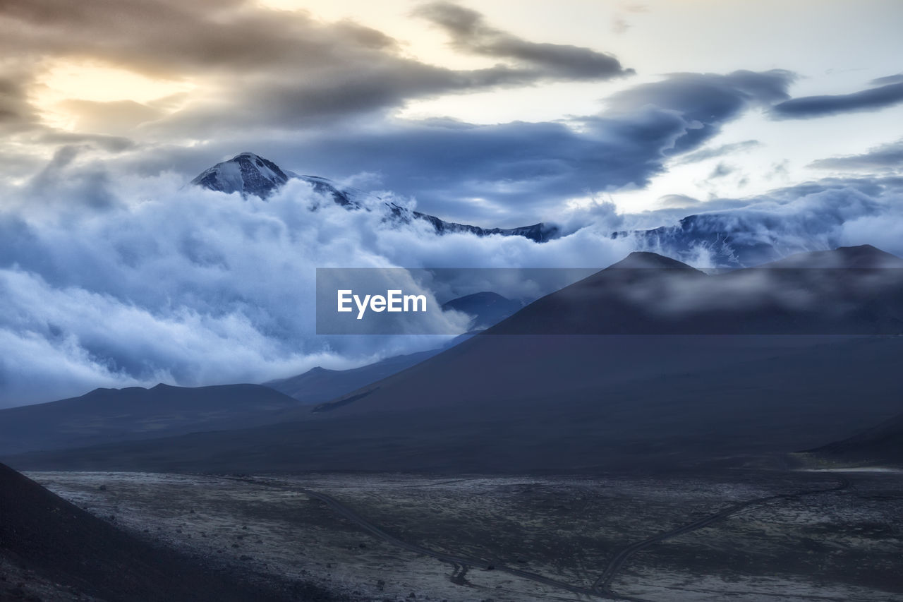 Scenic view of snowcapped mountains against sky