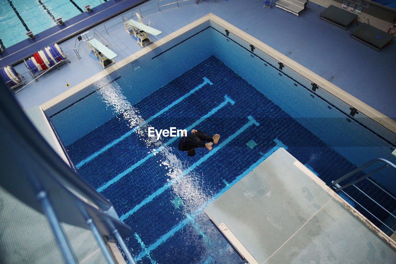 High angle view of young man diving in pool