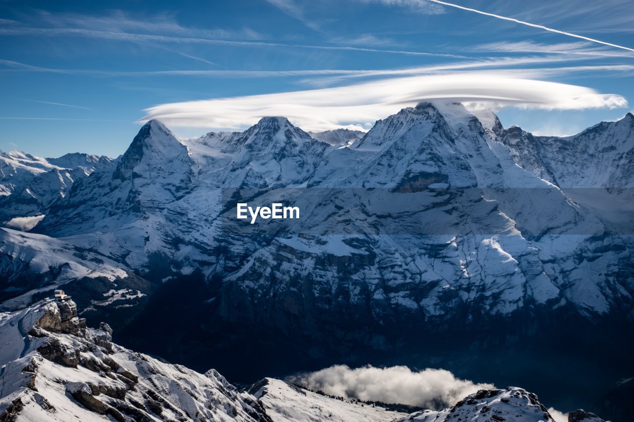 Scenic view of snowcapped mountains against sky