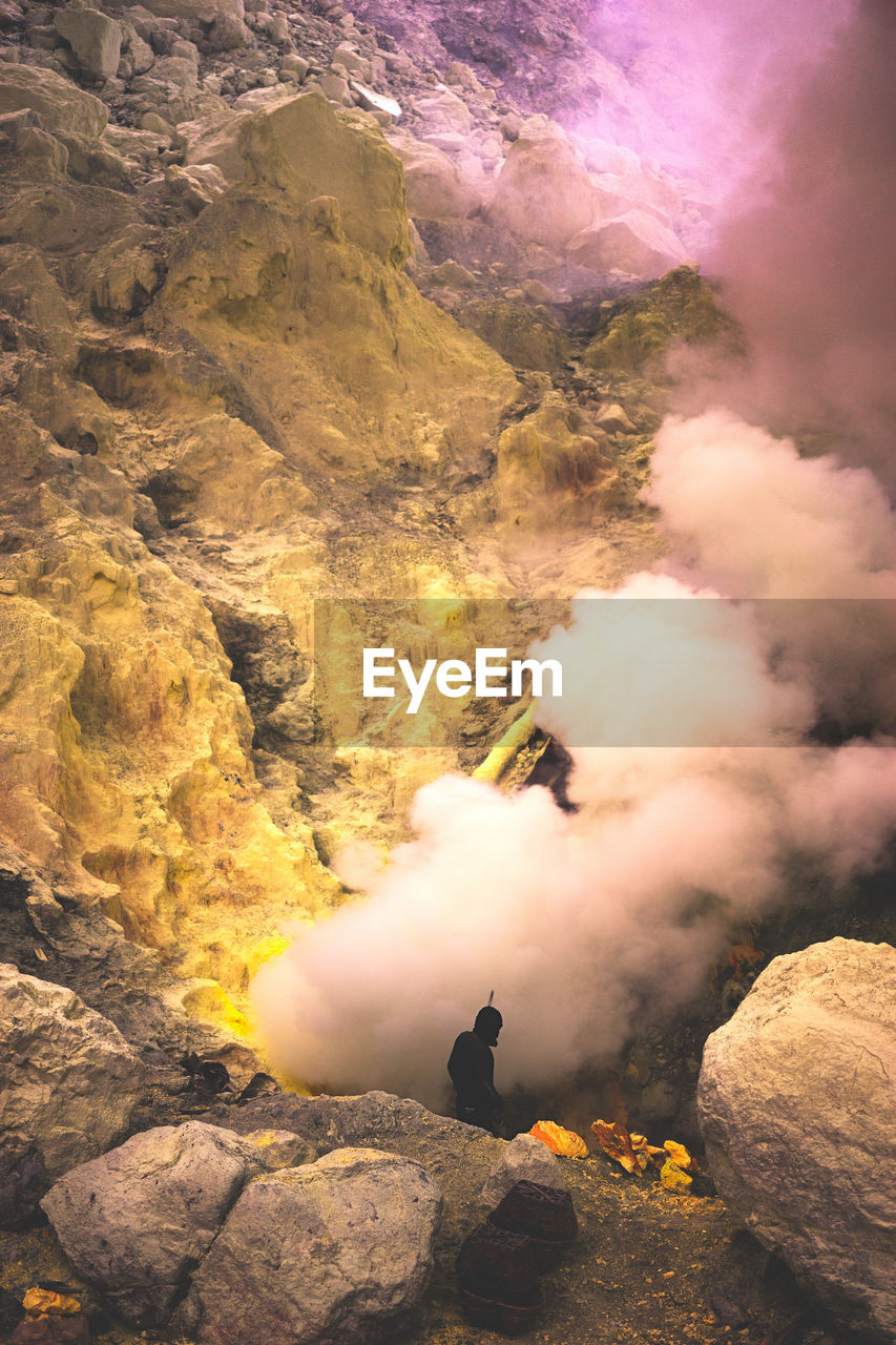 Man standing on volcano