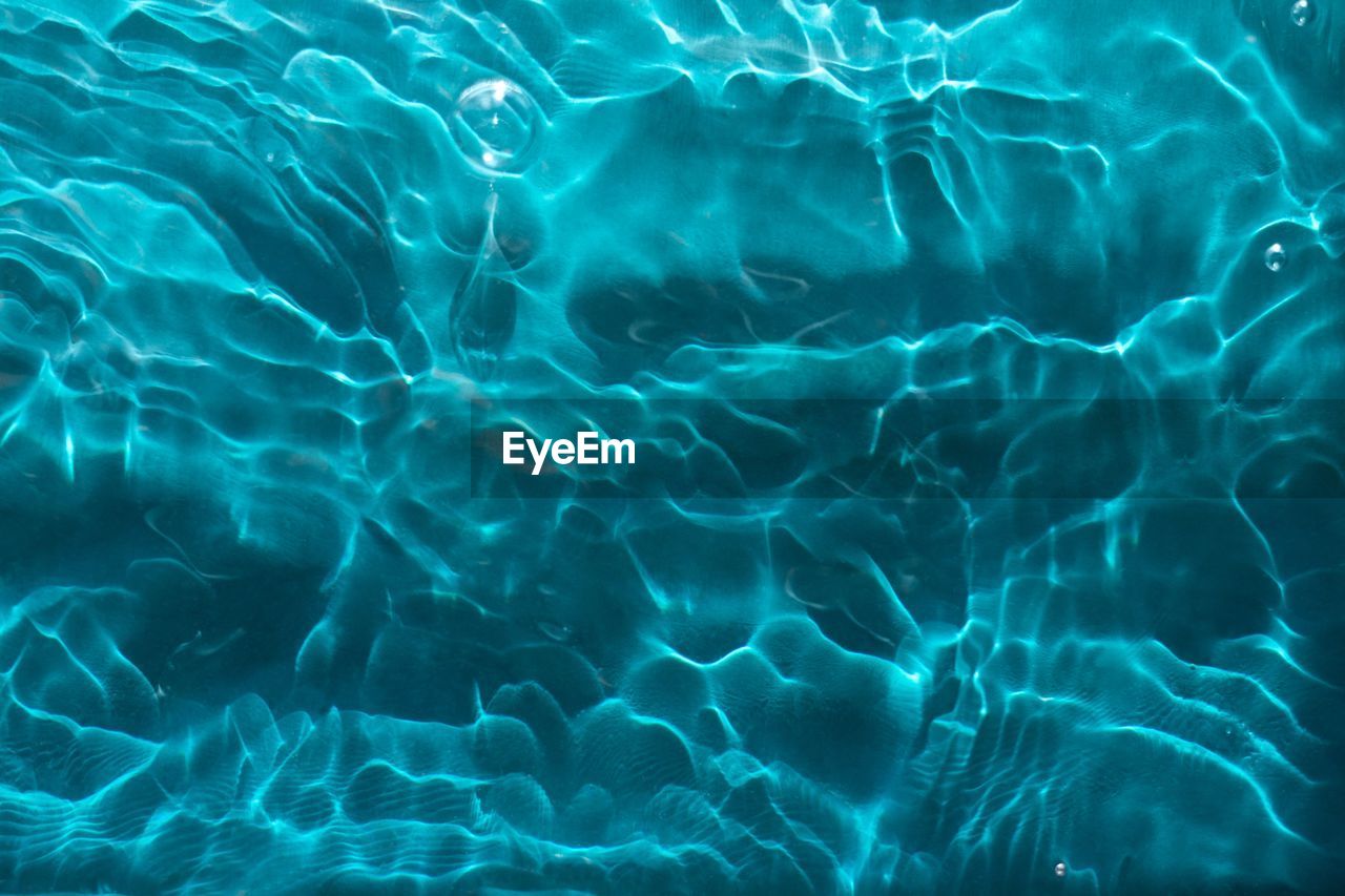 FULL FRAME SHOT OF SWIMMING UNDERWATER