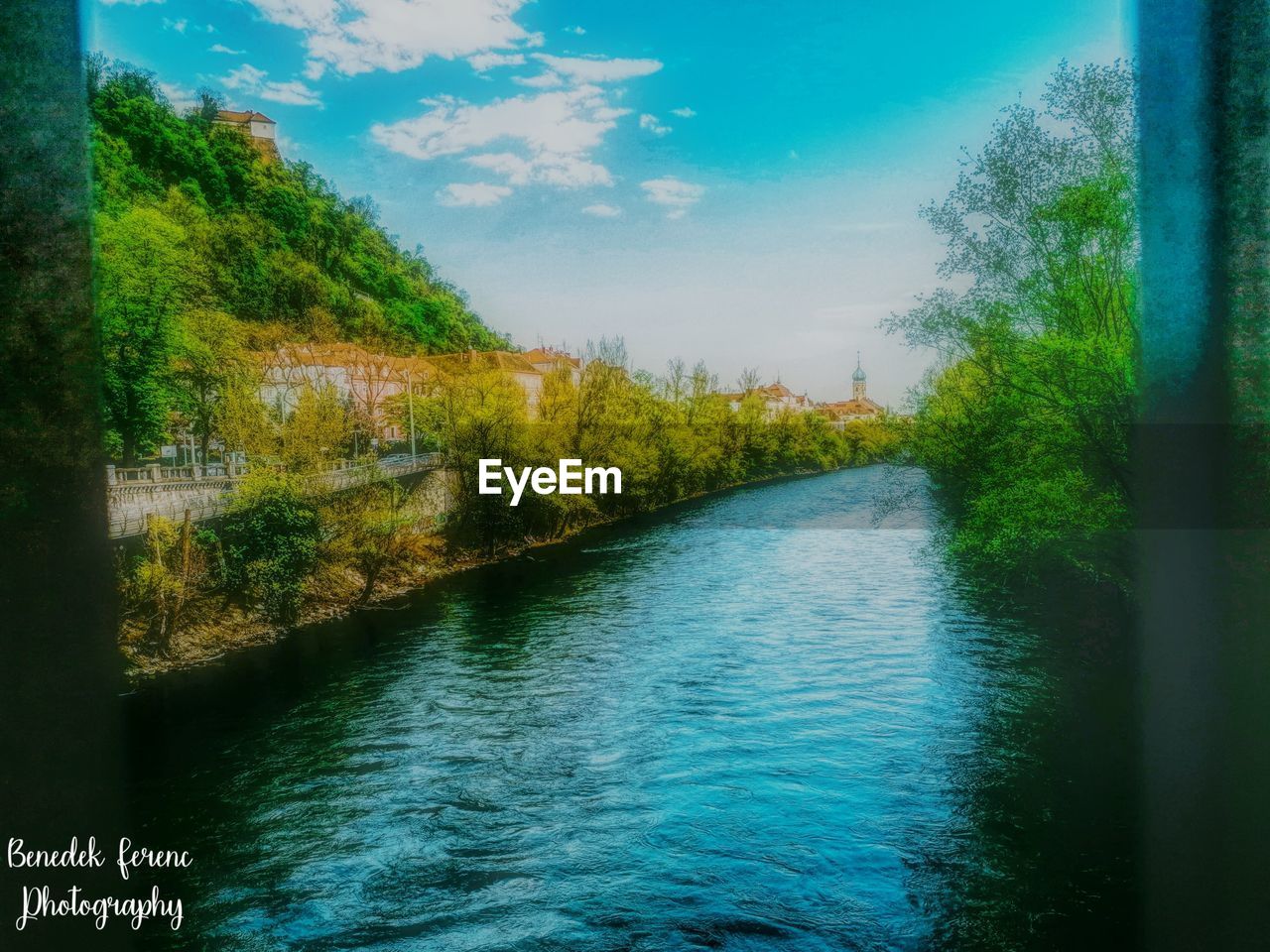 RIVER AMIDST TREES AGAINST SKY
