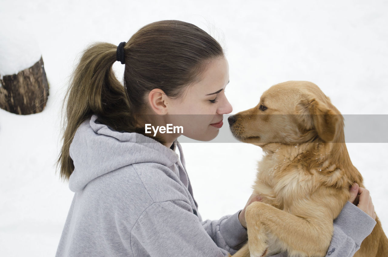 Close-up of woman with dog