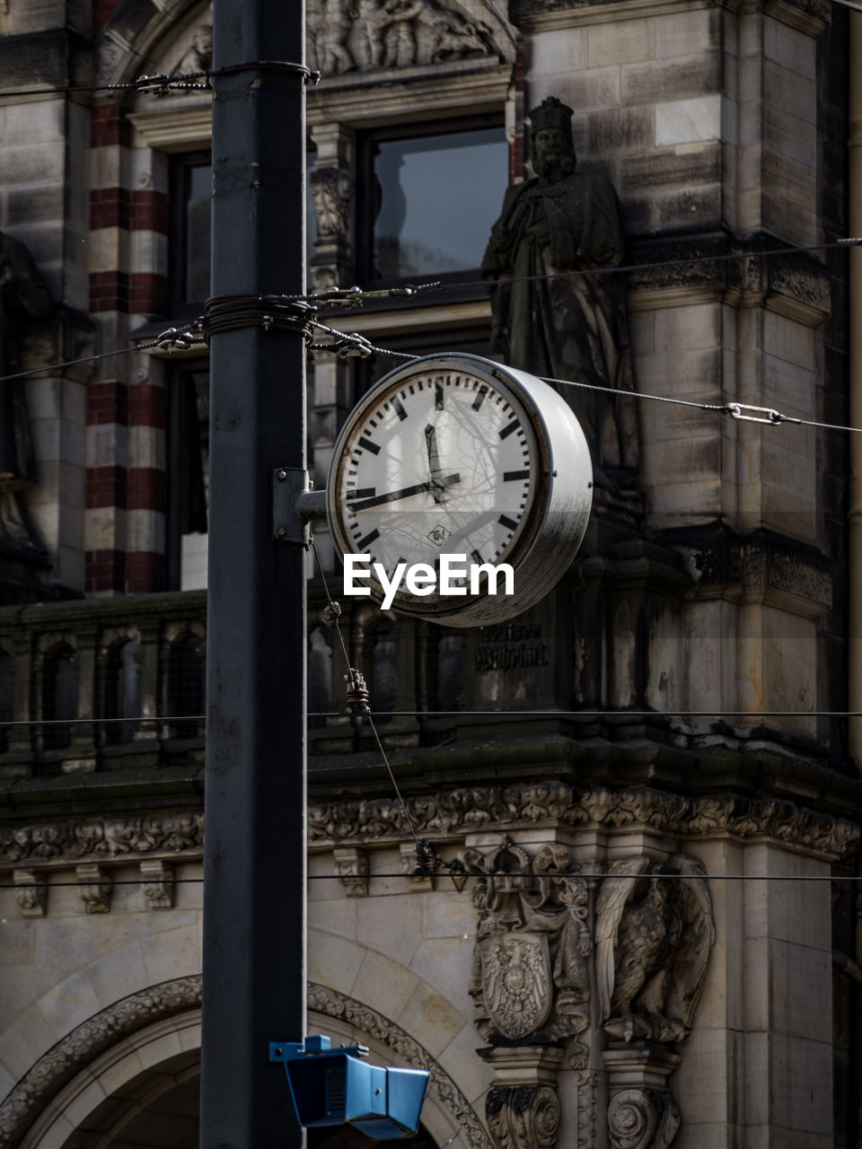 LOW ANGLE VIEW OF OLD CLOCK TOWER