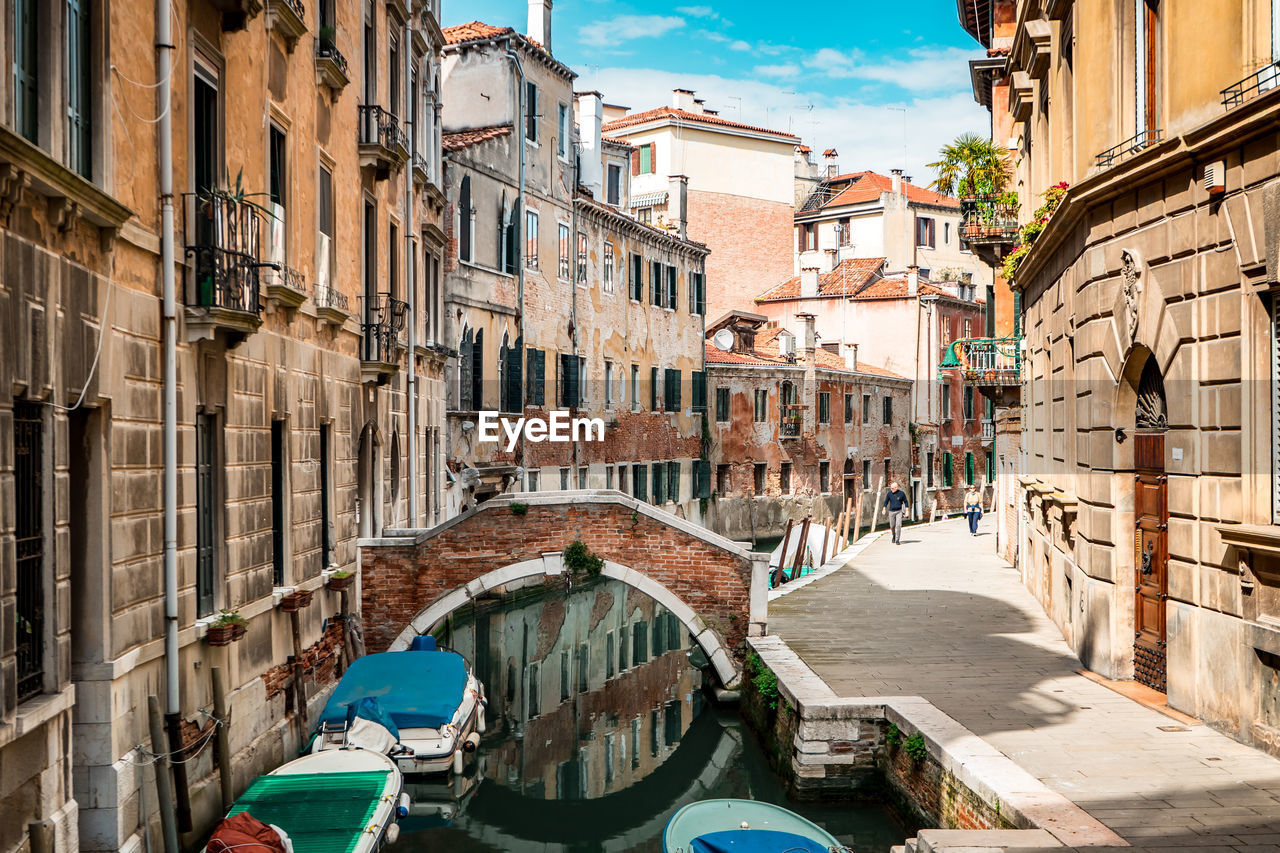 Grand canal amidst buildings against sky