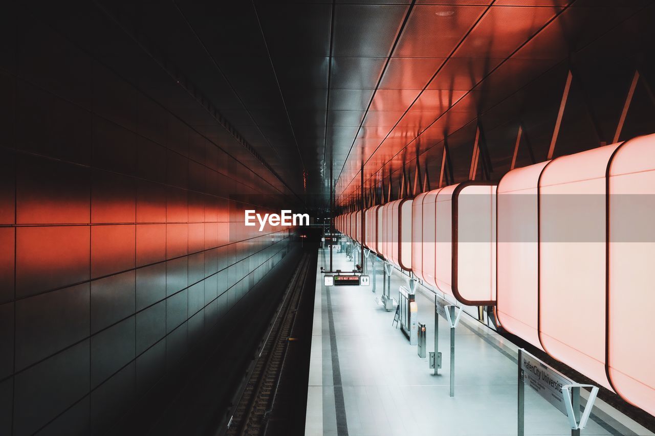 Empty illuminated subway station