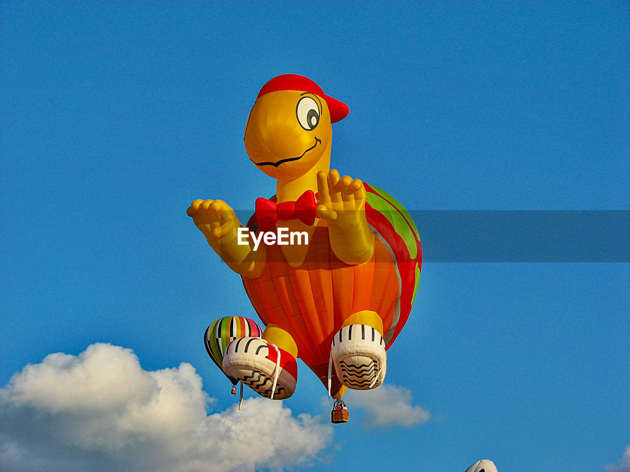 Low angle view of hot air balloon flying against sky