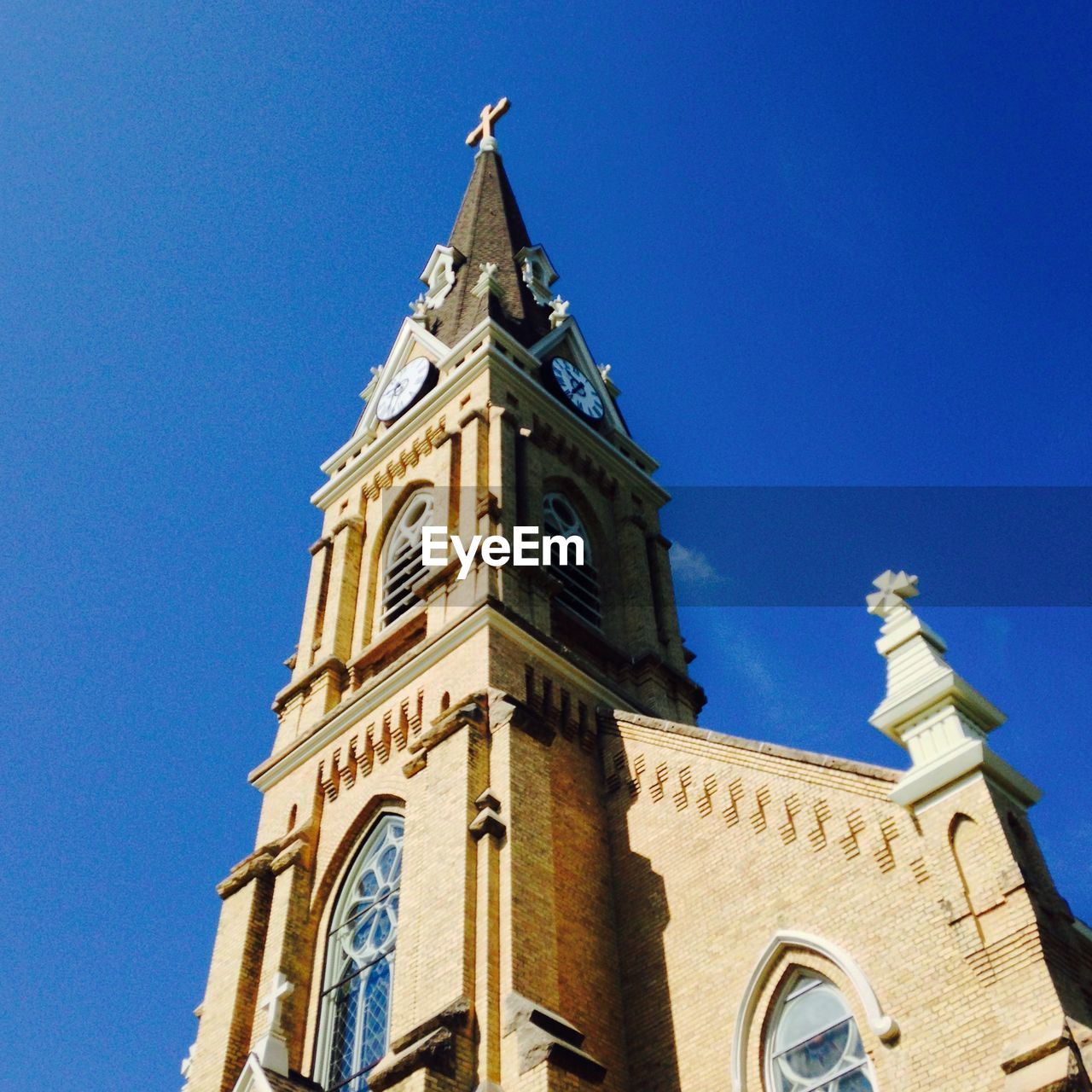 Low angle view of st michael catholic church against clear blue sky