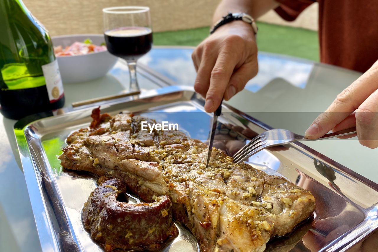 Midsection of person preparing food on table