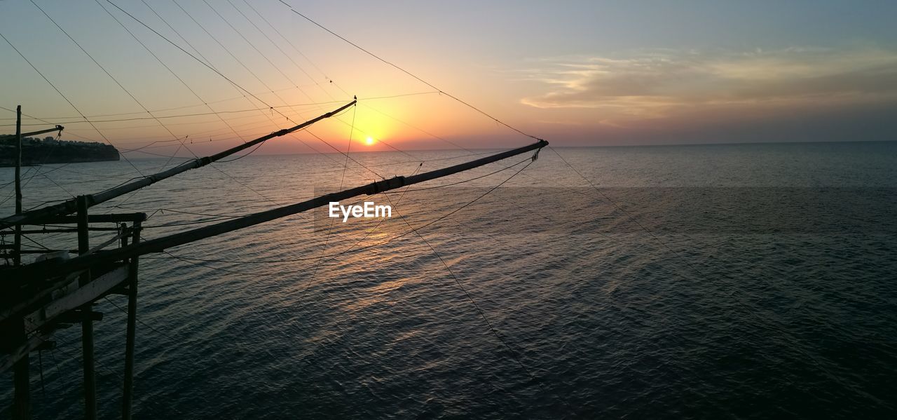 Scenic view of sea against sky at sunset