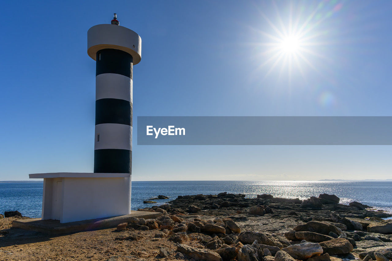 The far de sestalella lighthouse in mallorca in the sunshine