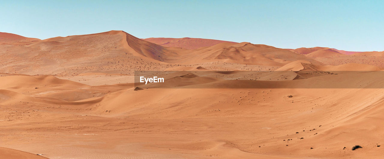 Scenic view of desert against clear sky