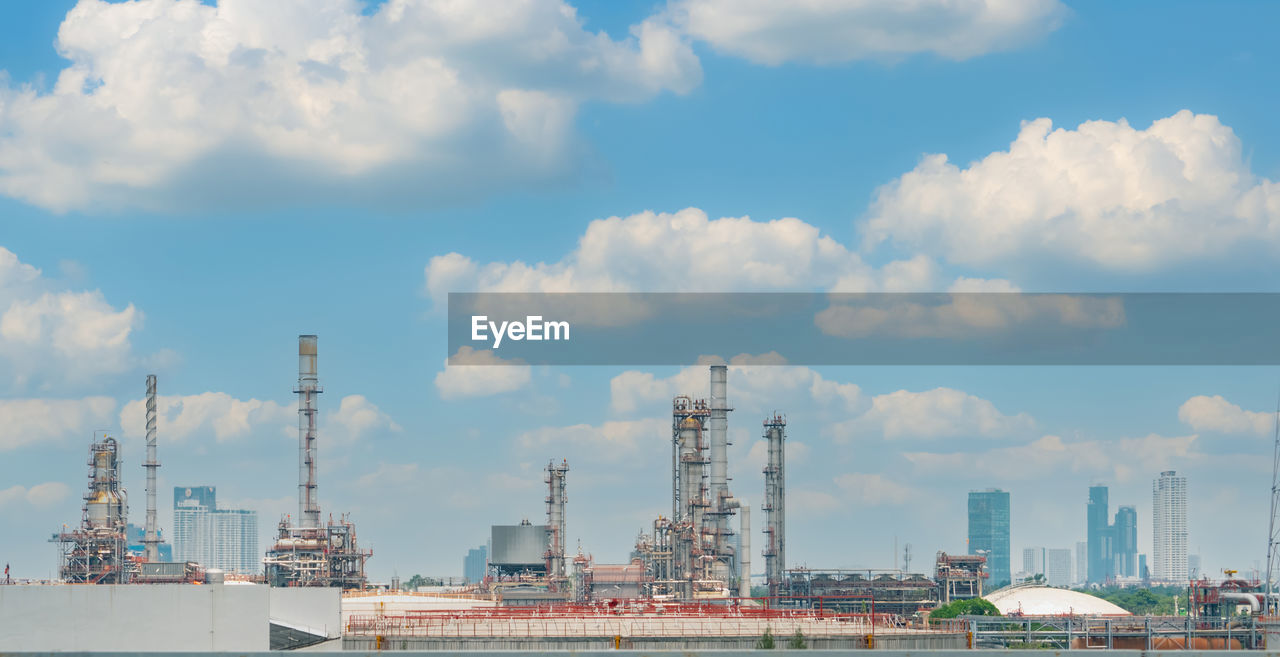 Oil refinery or petroleum refinery plant with blue sky background. power and energy industry. 