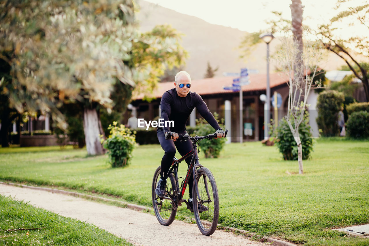 Man riding bicycle at park