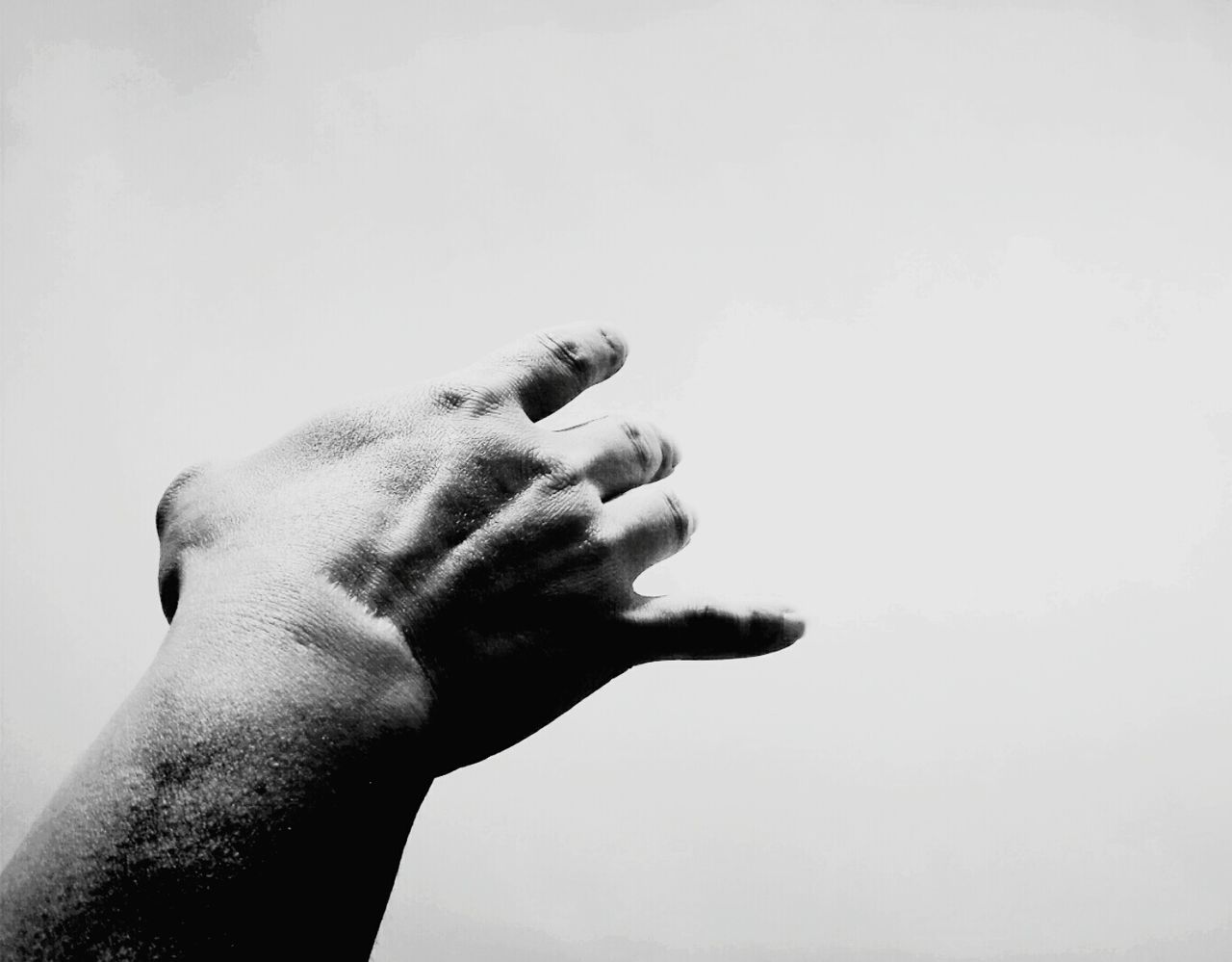 Cropped image of hand against white background