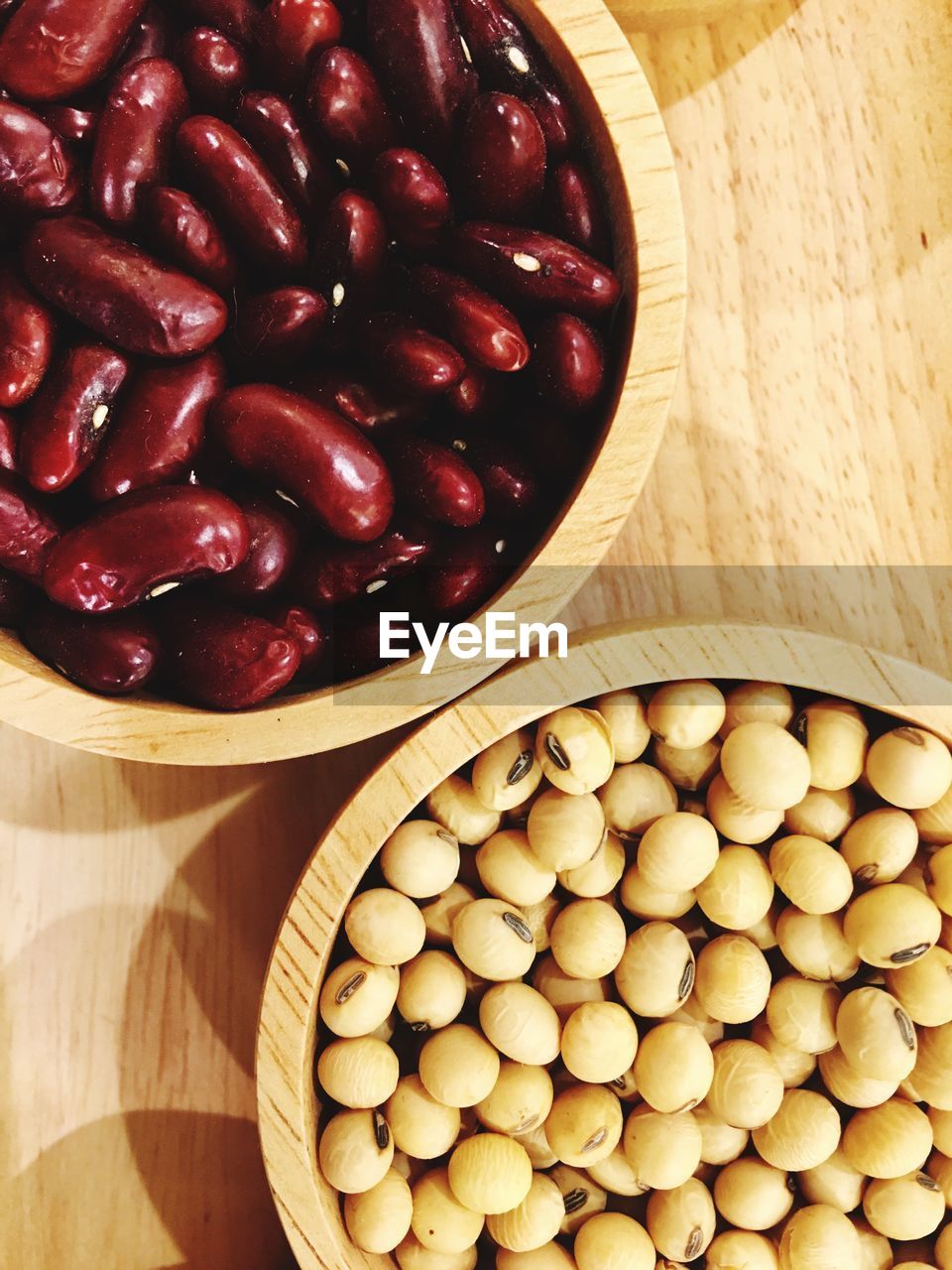 Directly above shot of beans in bowls on table