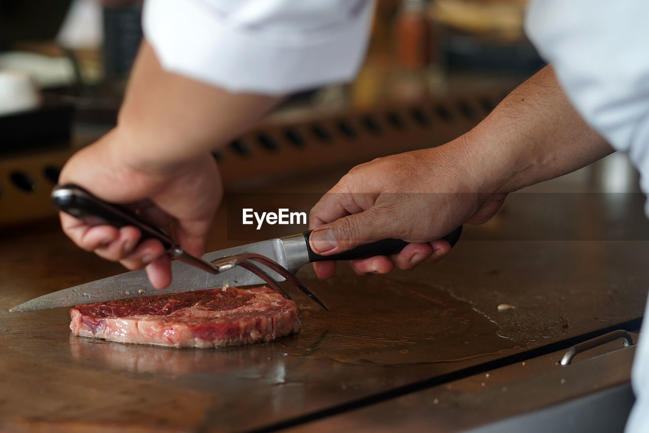 Midsection of man preparing food