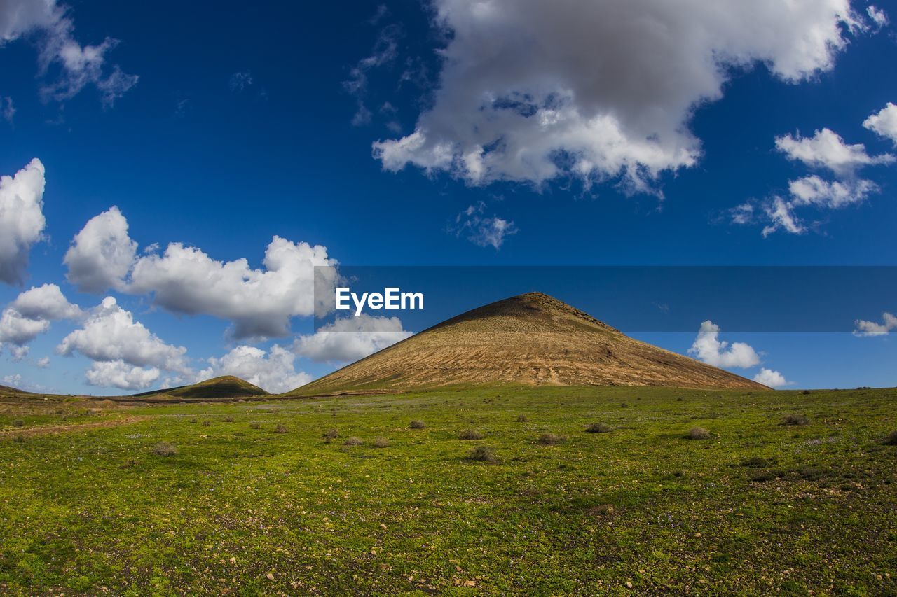 PANORAMIC VIEW OF LANDSCAPE AGAINST CLOUDY SKY