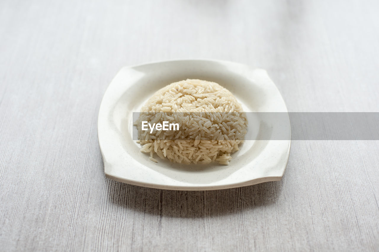 High angle view of rice in plate on table