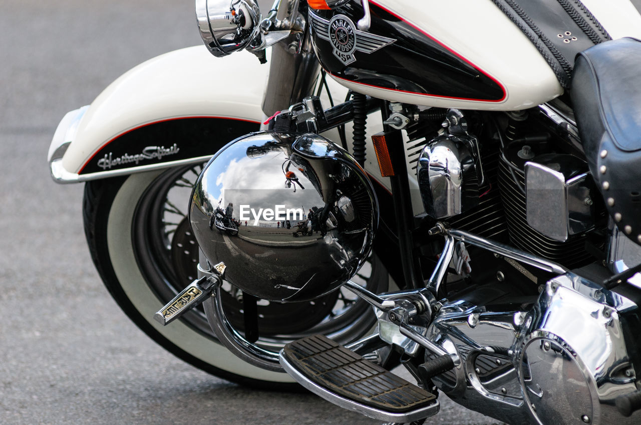 CLOSE-UP OF MOTORCYCLE ON STREET