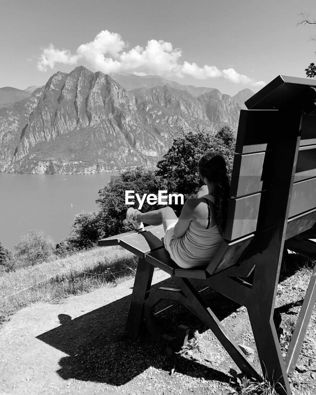 mountain, nature, mountain range, black and white, sitting, seat, beauty in nature, scenics - nature, adult, relaxation, chair, sky, monochrome photography, leisure activity, one person, monochrome, white, landscape, sunlight, full length, environment, tranquil scene, land, day, furniture, tranquility, black, vacation, activity, outdoors, plant, travel, trip, holiday, men, women, lifestyles, travel destinations, cloud, bench, non-urban scene
