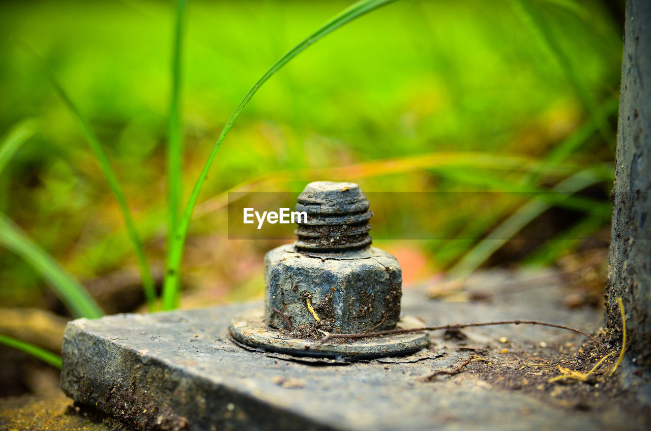 Close-up of bolt in built structure