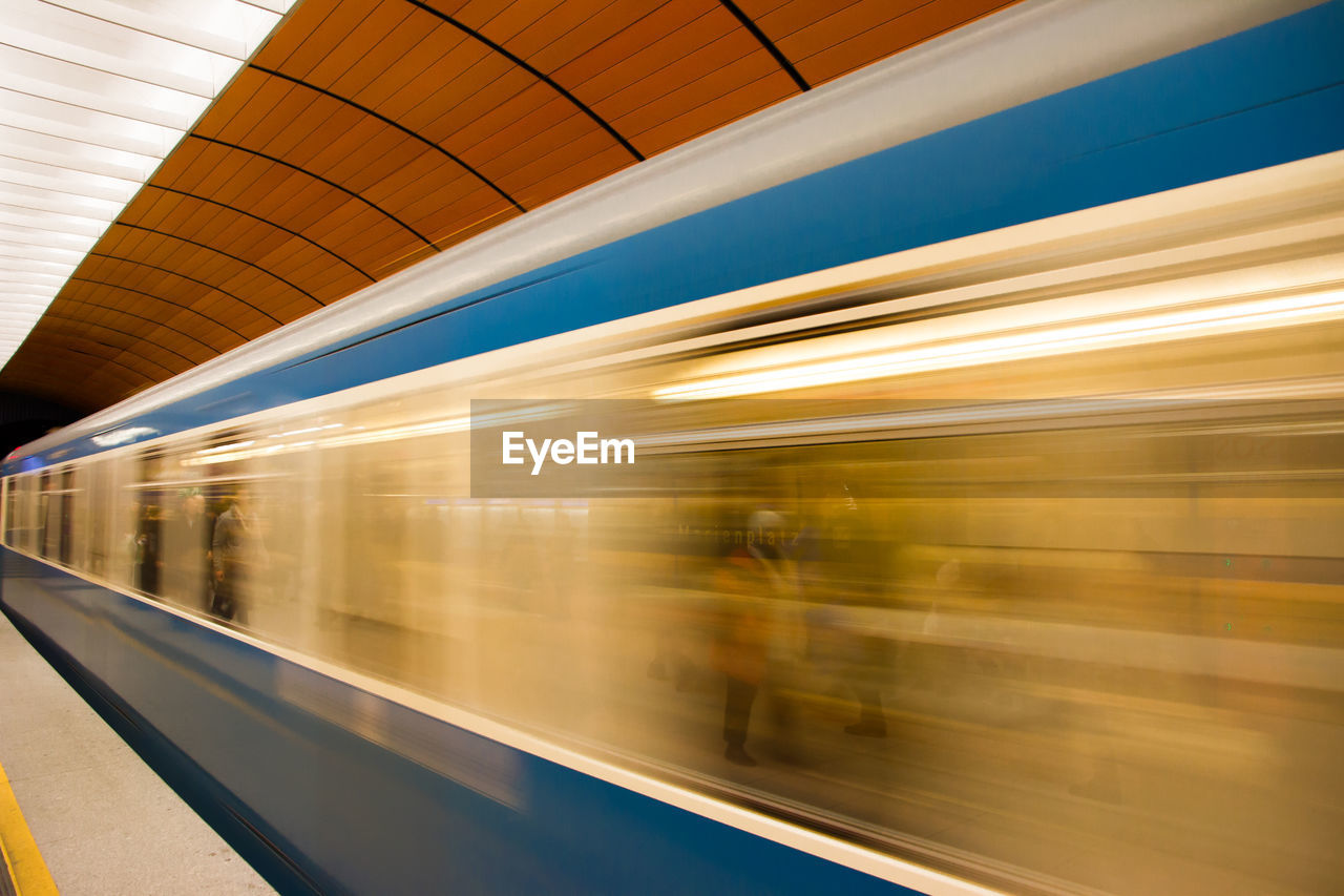 BLURRED MOTION OF TRAIN AT STATION