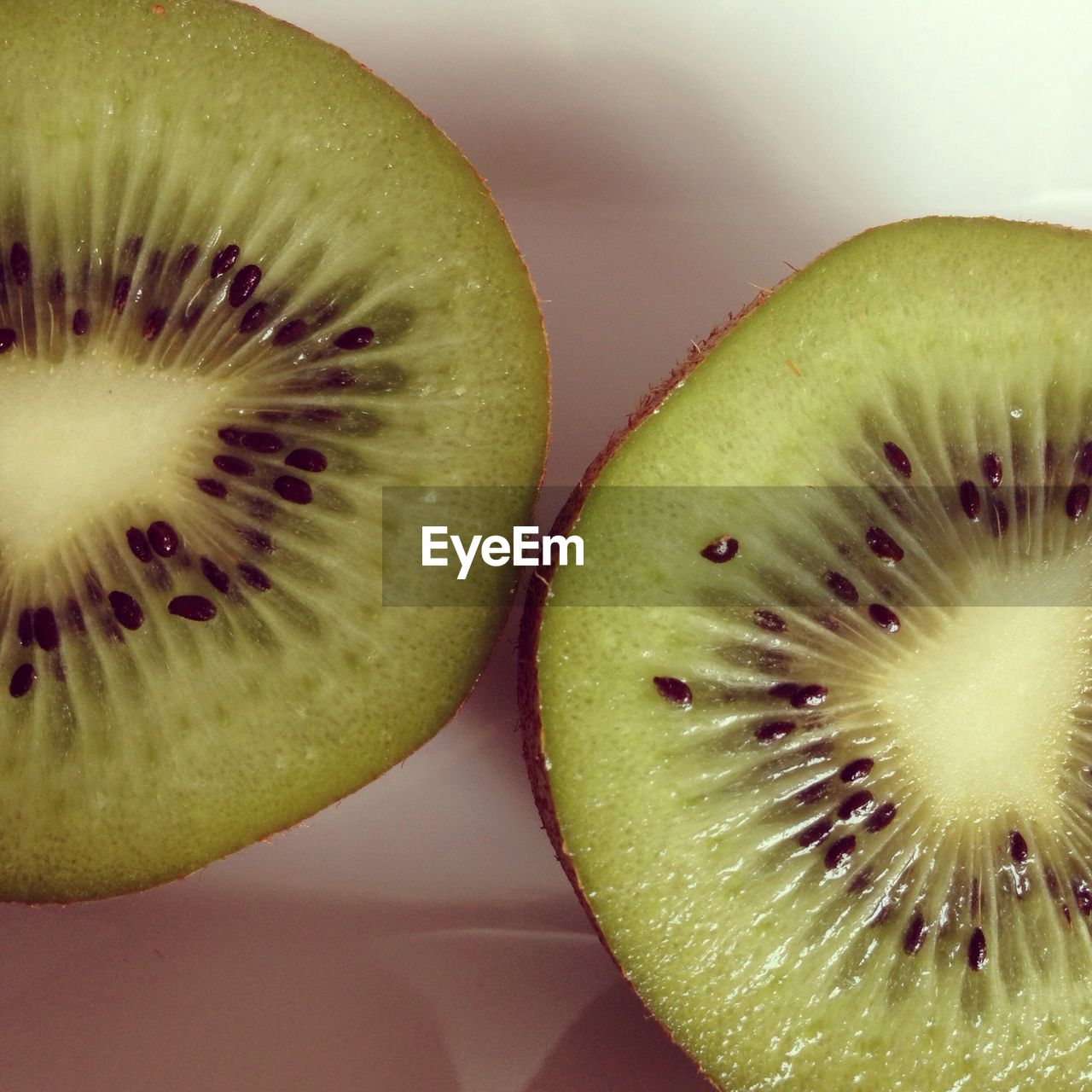 Close-up of two kiwi slices